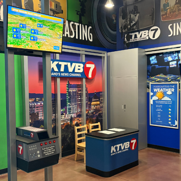 Kids' sized news station with spots for weather and regular reporting