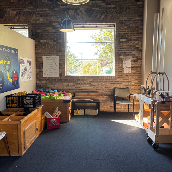 room with foam building blocks, bottle rocket air shooters, and rig-a-ma-jig building pieces 